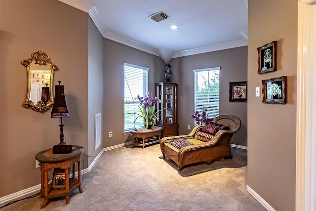 sitting room featuring crown molding and carpet flooring