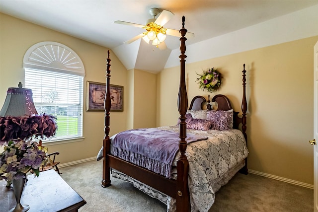 carpeted bedroom with vaulted ceiling and ceiling fan