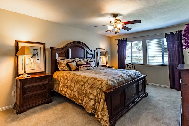 bedroom with light colored carpet and ceiling fan