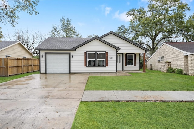 view of front of home featuring a garage and a front lawn