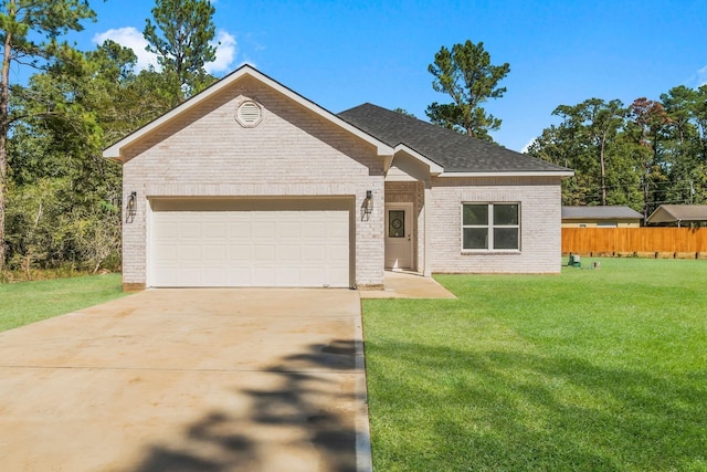 view of front of home with a garage and a front yard