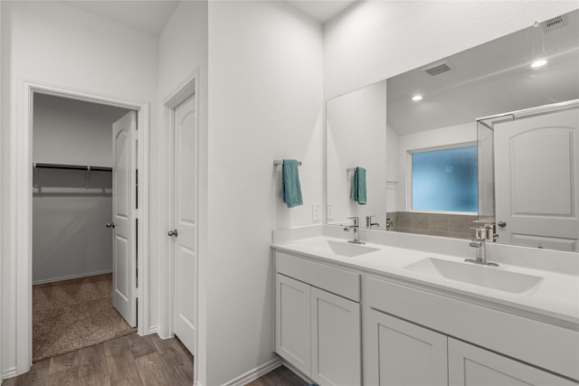 bathroom featuring vanity and hardwood / wood-style flooring