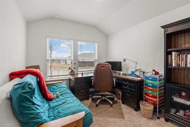 office space with vaulted ceiling and light colored carpet