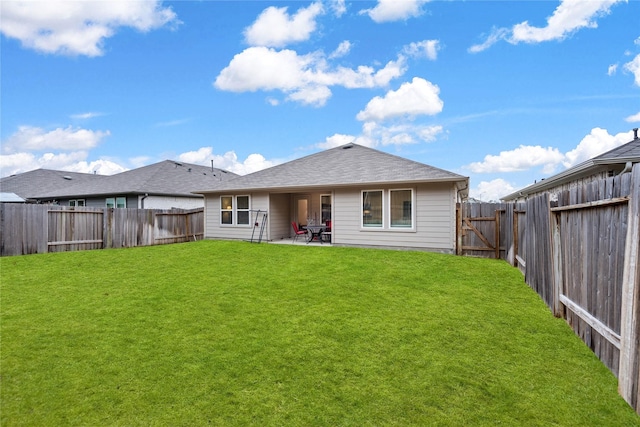 rear view of house featuring a patio and a lawn