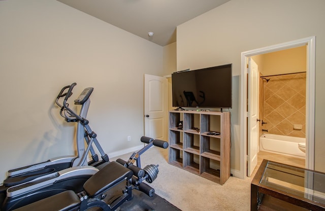 exercise room with light colored carpet