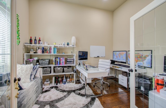 office with french doors and hardwood / wood-style floors