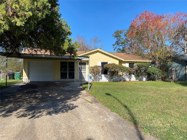 single story home featuring a garage and a front lawn