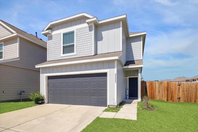 view of front facade with a garage and a front yard