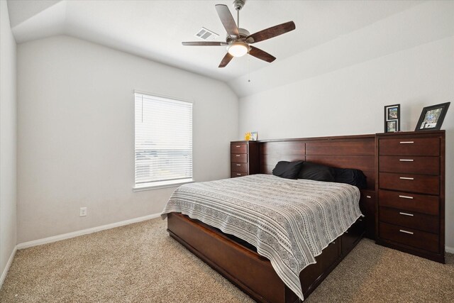 bedroom featuring light colored carpet, ceiling fan, and vaulted ceiling