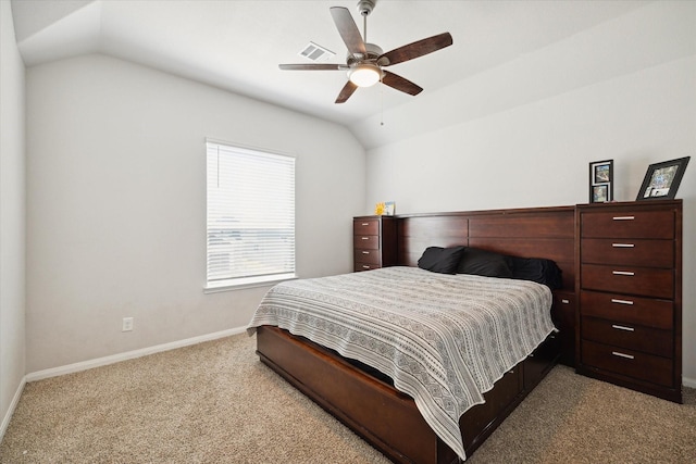 bedroom with lofted ceiling, light colored carpet, and ceiling fan