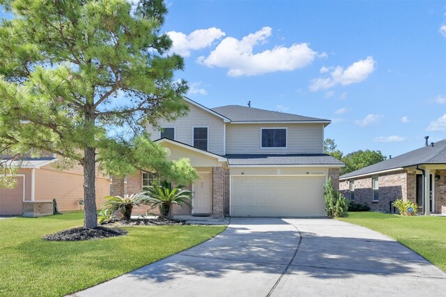 front facade featuring a garage and a front lawn