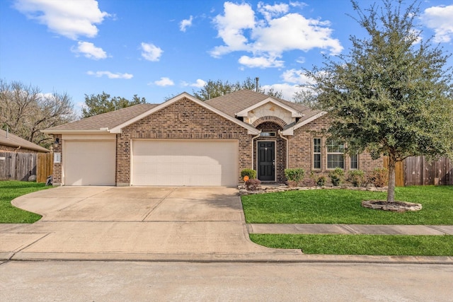 view of front of home featuring a garage and a front yard