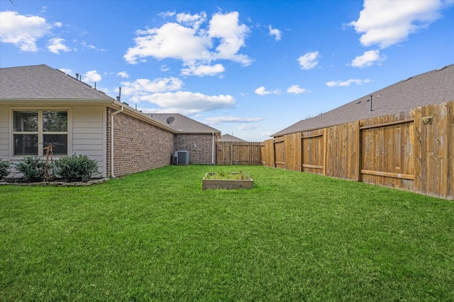 view of yard with central AC