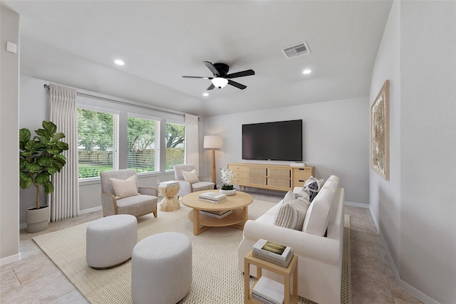 living room with light tile patterned floors and ceiling fan