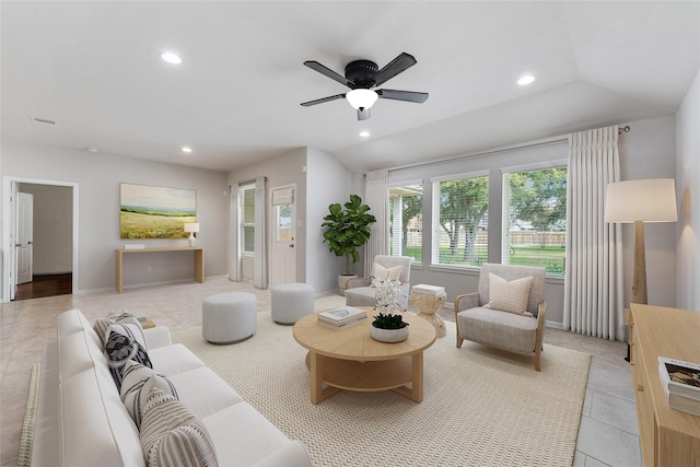 tiled living room featuring ceiling fan