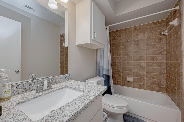 full bathroom with vanity, toilet, and shower / tub combo