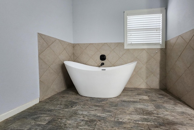 bathroom with a tub to relax in