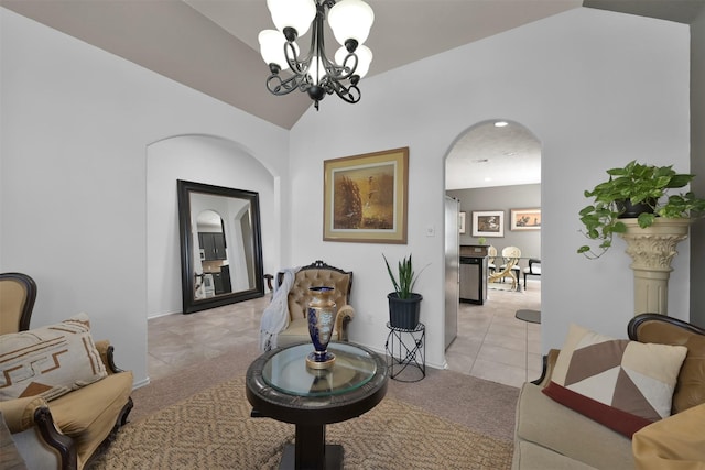 interior space with light carpet, lofted ceiling, and a chandelier