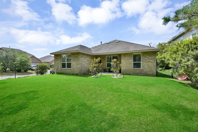 back of house featuring a yard