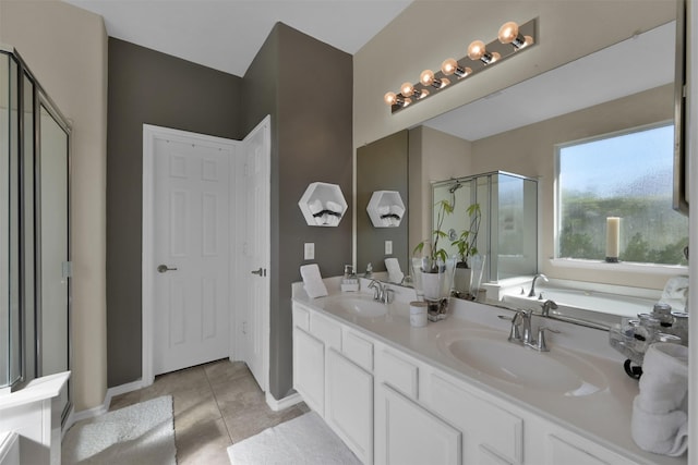 bathroom featuring plus walk in shower, tile patterned floors, and vanity