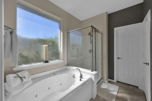 bathroom with tile patterned flooring and independent shower and bath