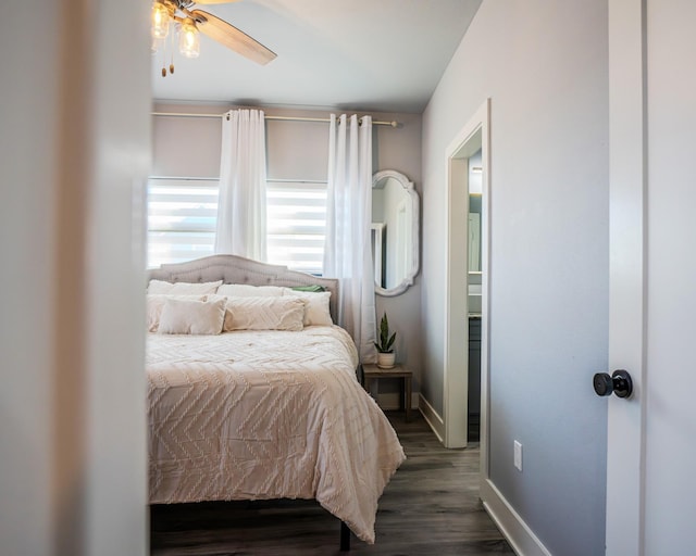 bedroom featuring ceiling fan and dark hardwood / wood-style flooring