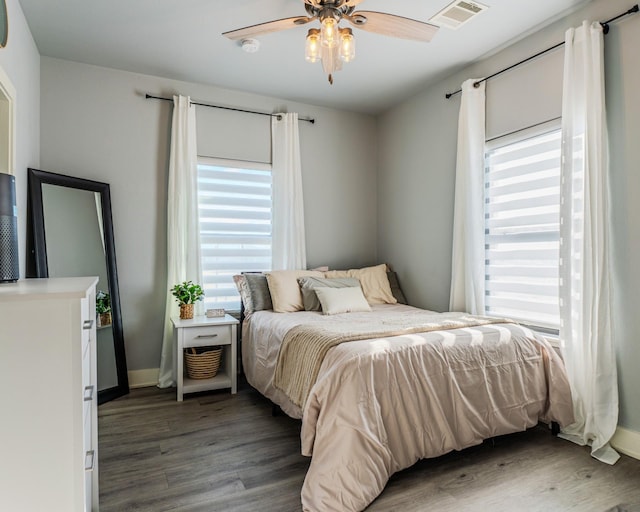 bedroom featuring dark wood-type flooring and ceiling fan