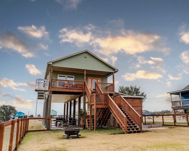 rear view of house with a fire pit