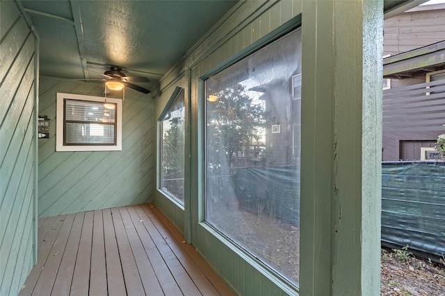 exterior space with ceiling fan