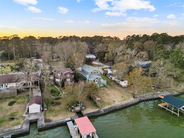 aerial view at dusk with a water view