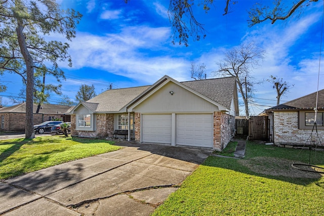 ranch-style home featuring a garage and a front yard