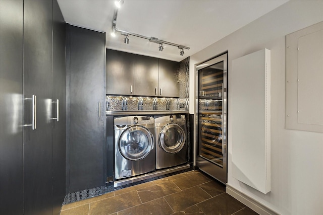 laundry room with cabinets, independent washer and dryer, beverage cooler, and electric panel