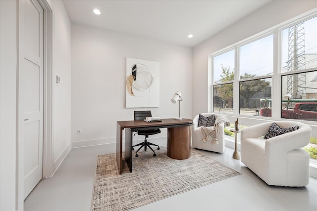 office area with concrete floors