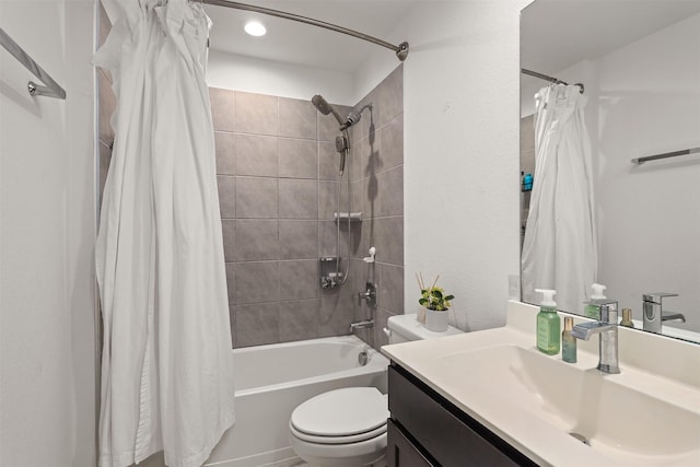 full bathroom featuring vanity, shower / bath combination with curtain, and toilet