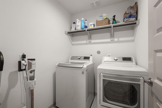 laundry room featuring separate washer and dryer