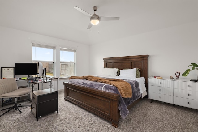 carpeted bedroom featuring lofted ceiling and ceiling fan