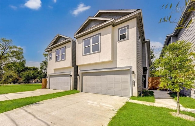 view of front of property featuring a garage and a front yard