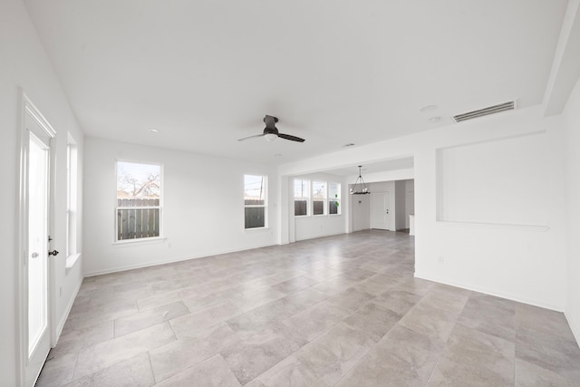 unfurnished living room featuring ceiling fan