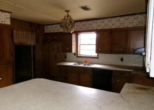 kitchen with black dishwasher and sink