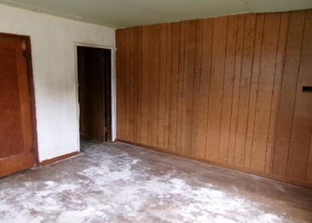 empty room with wood walls