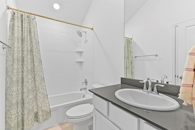 full bathroom with vanity, shower / tub combo, and toilet