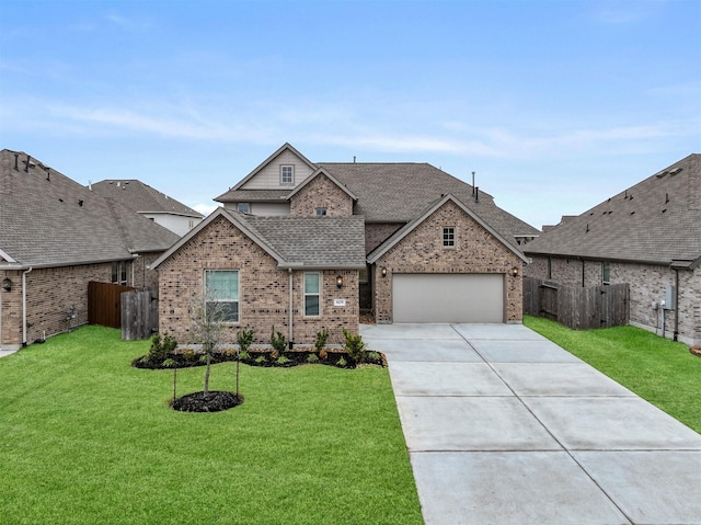 view of front of property featuring a garage and a front lawn