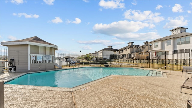 view of swimming pool with a patio area