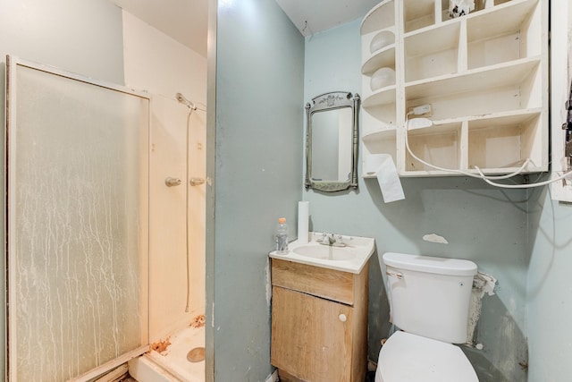 bathroom with walk in shower, vanity, and toilet