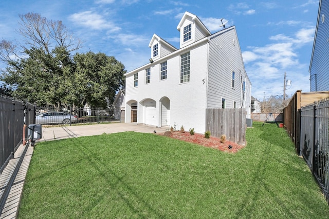 view of home's exterior featuring a garage and a lawn