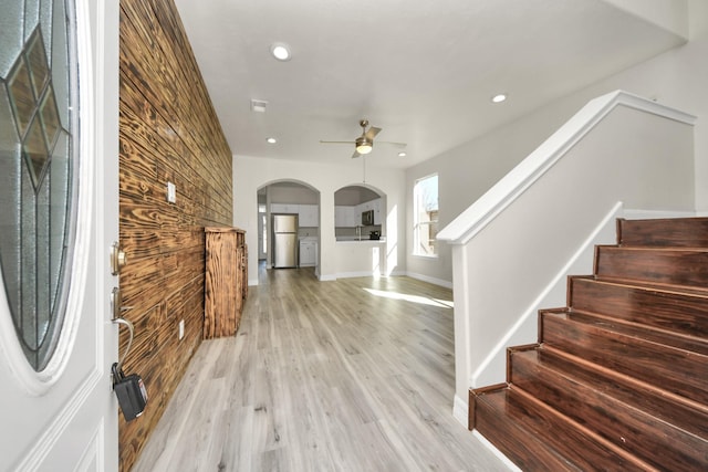 entrance foyer featuring ceiling fan and light wood-type flooring