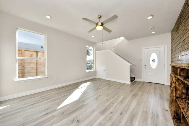 entrance foyer featuring light hardwood / wood-style floors and ceiling fan