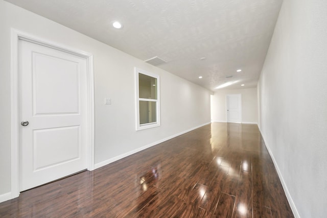 empty room featuring dark hardwood / wood-style floors