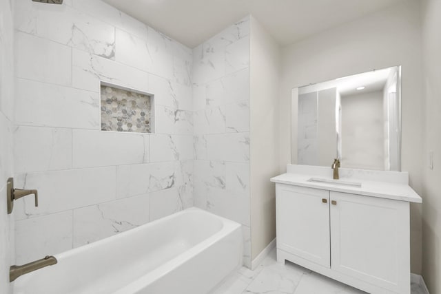 bathroom featuring vanity and tiled shower / bath combo