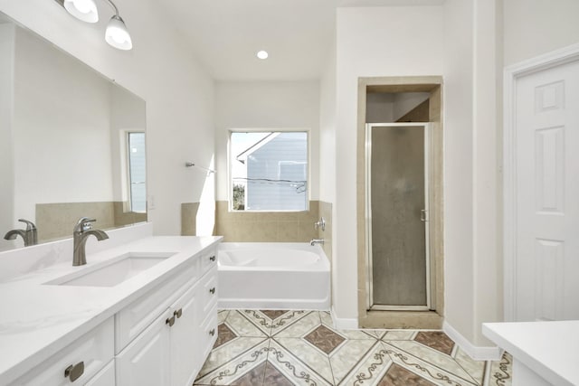 bathroom featuring tile patterned floors, vanity, and separate shower and tub